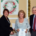 foster carers - a carer being presented with a certificate