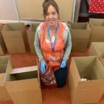 Staff member Stacey Kerr helping to assemble the ‘Happy Boxes’