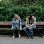 two people on a park bench