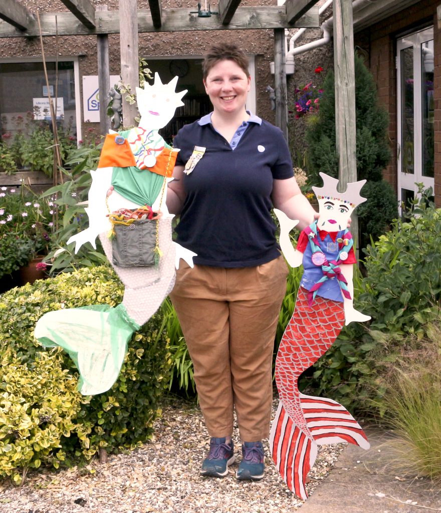 All set to make a splash – Trainee Guide leader Anna Gallen with the two of the meremaid figures made by Ellesmere Guides and Brownies .