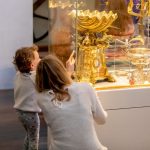 A parent and child at the museum