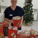 Nurse with gift bags for newborns