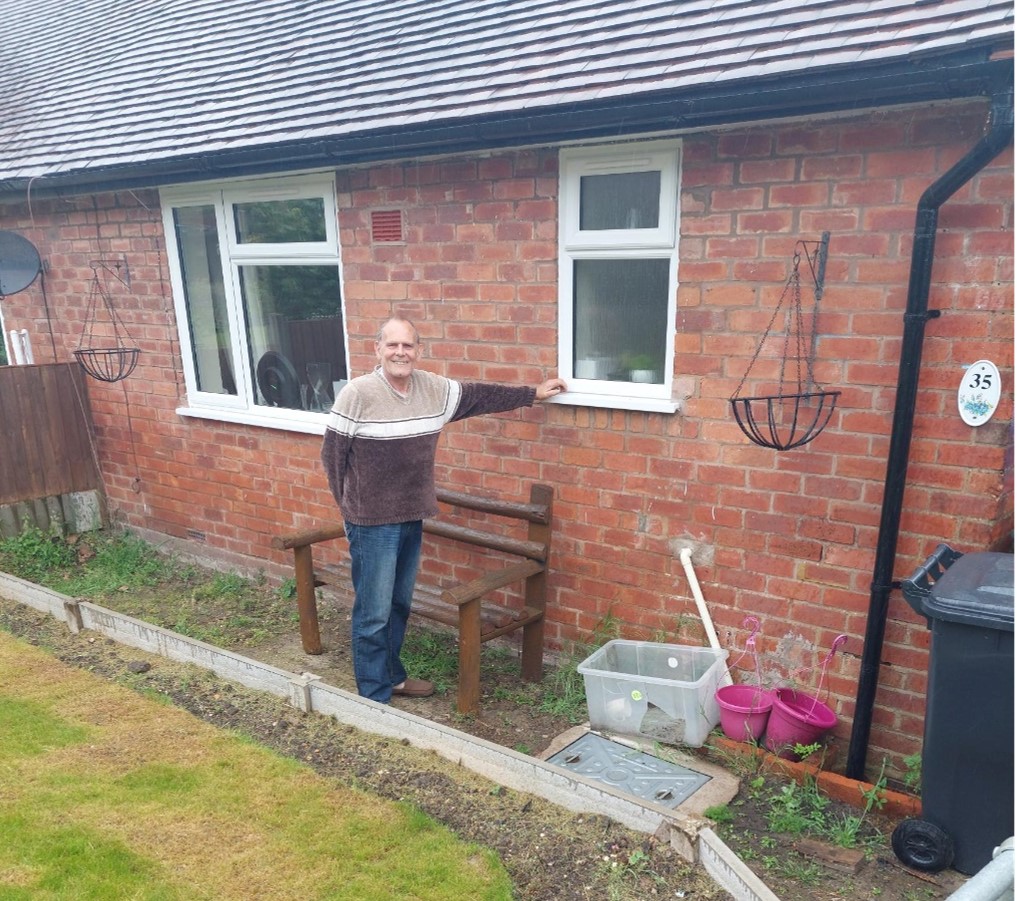 Man outside a house