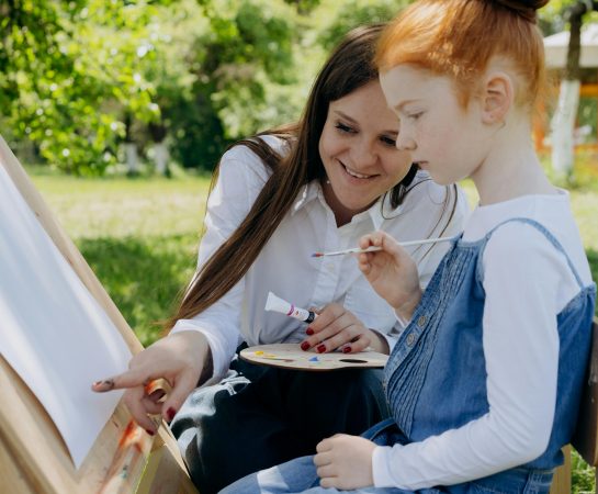 Library image of woman and young girl painting: Credit Mikhail Nilov, Pexels images