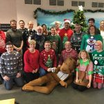 Staff who work in premises services, wearing Christmas jumpers