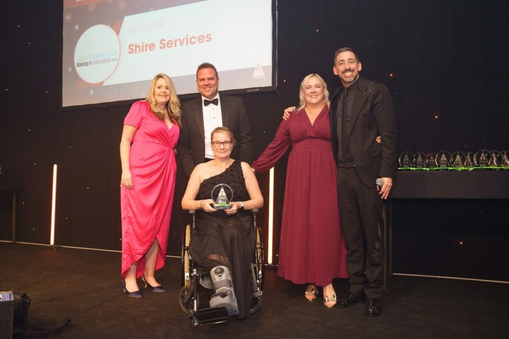 Shire Services win a marketing award. l-to-r: Lauren Moore, Shire Services catering area manager; Jon White, Wafflemeister - sponsors of the award; Susan Vuli, Shire Services general manager; Kelly Braddock, Shire Services catering contract manager; Colin Murray, TV and radio presenter.