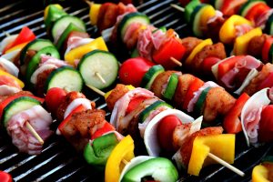 Vegetables and meat skewers on a barbecue