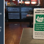 Spot checks - a sign on a table in a pub