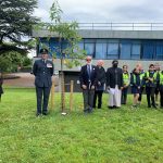 (l to r) Lois Dale (Shropshire Council's rurality equality specialist), Wing Commander Turner, Mark Michaels, Reverend Ken Chippindale, Imam Sohayb Peerbhai; and children of Mereside School.