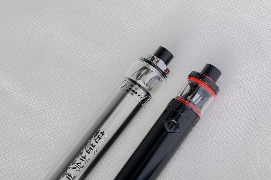 Two vaping devices on a white background