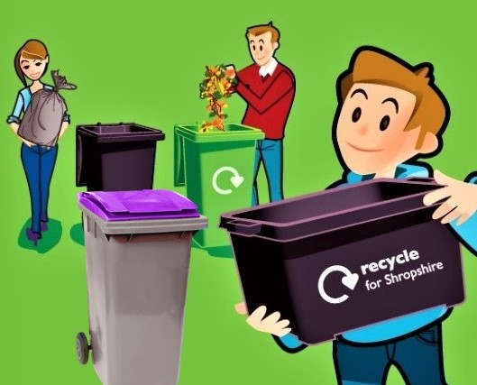 A family with a selection of wheelie bins and recycling boxes